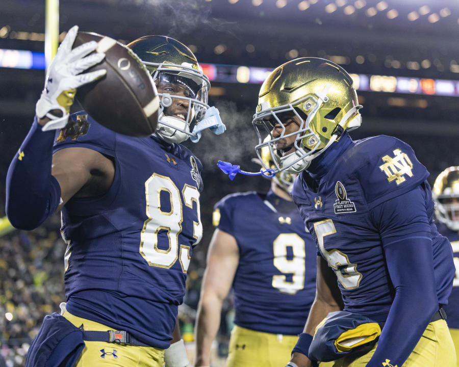 SOUTH BEND, INDIANA - DECEMBER 20: Jayden Thomas #83 is congratulated by Beaux Collins #5 of the Notre Dame Fighting Irish during a game between the Indiana Hoosiers and the Notre Dame Fighting Irish in the Playoff First Round game at Notre Dame Stadium on December 20, 2024 in South Bend, Indiana. (Photo by Steve Limentani/ISI Photos/Getty Images)