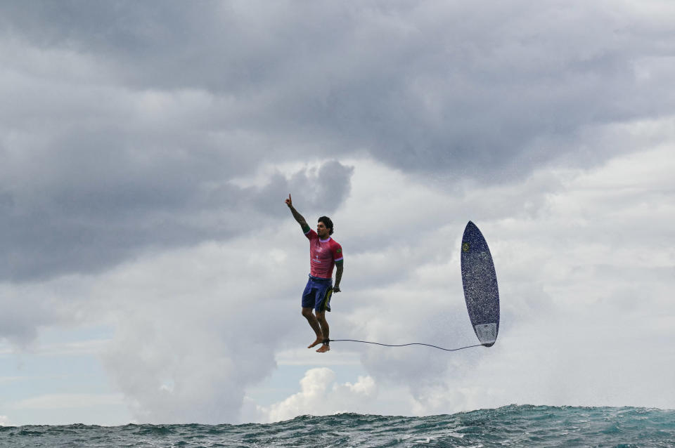 Brazil's Gabriel Medina reacts after getting a large wave in the 5th heat of the men's surfing round 3, during the Paris 2024 Olympic Games, in Teahupo'o, on the French Polynesian Island of Tahiti, on July 29, 2024. (Photo by Jerome BROUILLET / AFP)