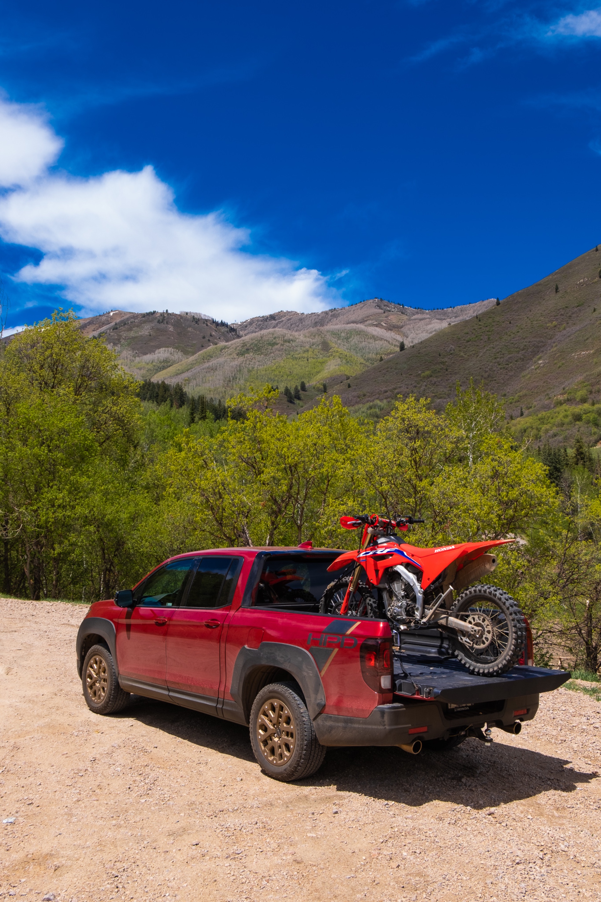 The Ridgeline with a CRF450RX in the bed.