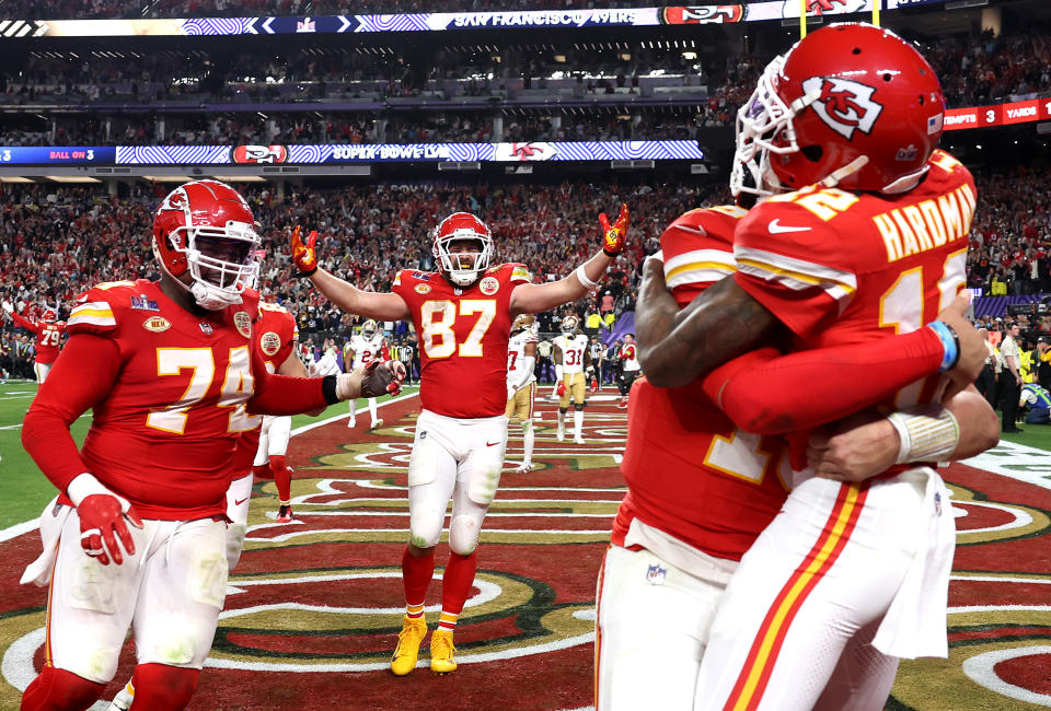 LAS VEGAS, NEVADA - FEBRUARY 11: Mecole Hardman Jr. #12 of the Kansas City Chiefs celebrates with Patrick Mahomes #15 and teammates after catching the game-winning touchdown pass to defeat the San Francisco 49ers 25-22  during Super Bowl LVIII at Allegiant Stadium on February 11, 2024 in Las Vegas, Nevada. (Photo by Ezra Shaw/Getty Images)