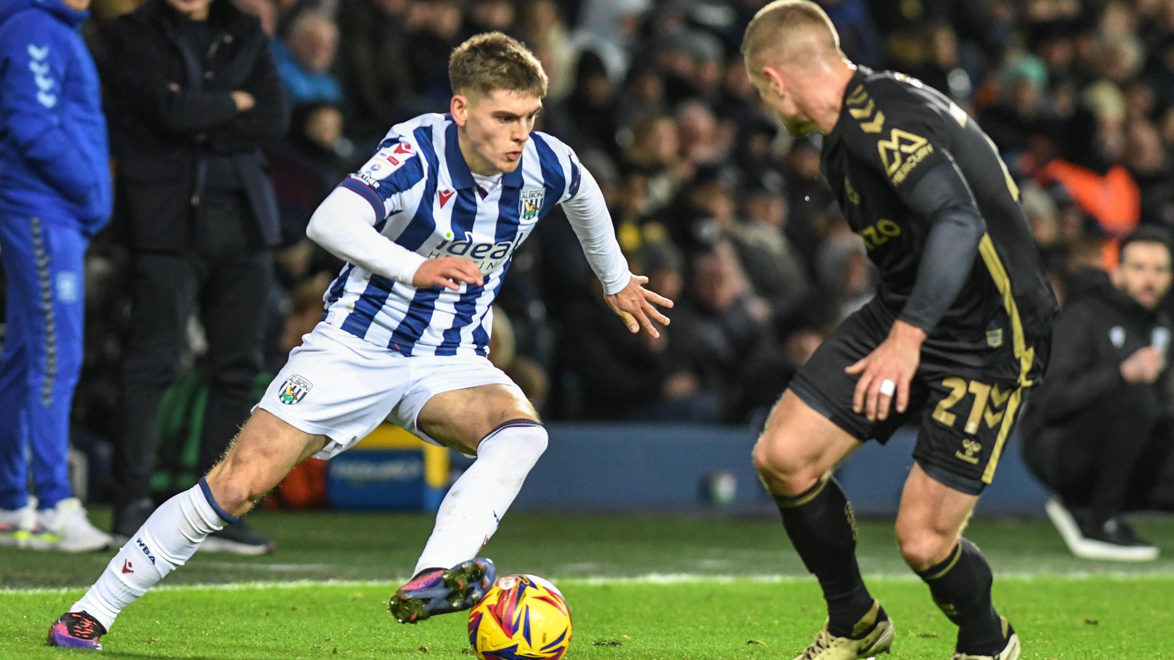 West Brom's Tom Fellows takes on Coventry's Jake Bidwell 