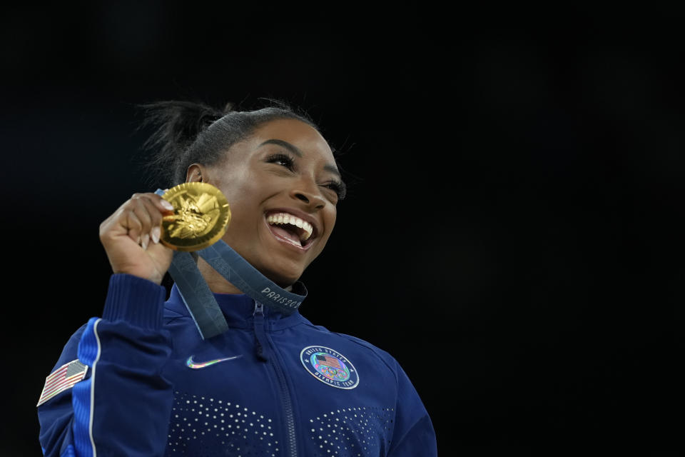 Simone Biles celebrates after winning the gold medal in the women's vault finals at the 2024 Summer Olympics. (AP Photo/Francisco Seco, File)