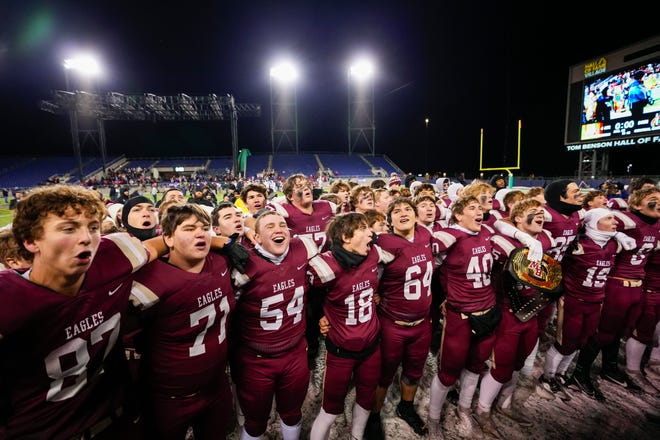 Columbus Bishop Watterson celebrates with the student section after defeating Toledo Central Catholic in the Division III State Championship game at Tom Benson Hall of Fame Stadium on Friday, Dec. 6, 2024 in Canton, Ohio.