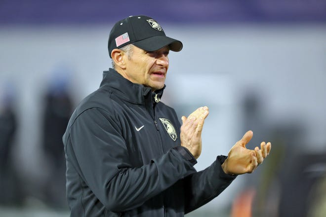 Dec 6, 2024; West Point, NY, USA; Army Black Knights head coach Jeff Monken watches his team warm up before the first half against the Tulane Green Wave at Michie Stadium. Mandatory Credit: Danny Wild-Imagn Images