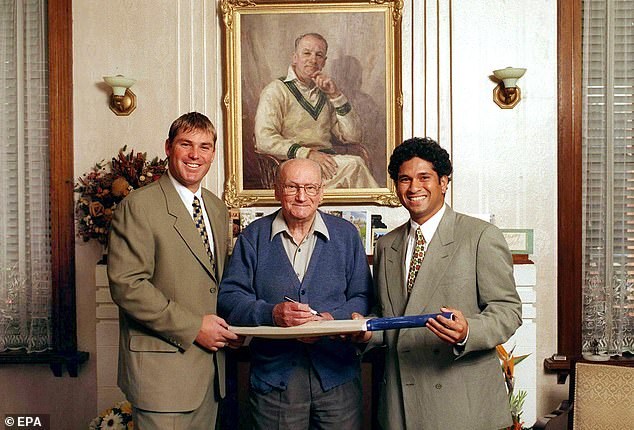 Bradman, pictured with Shane Warne and Sachin Tendulkar, cancelled an Australian tour of South Africa when he was chairman of the Australian Cricket Board in 1970