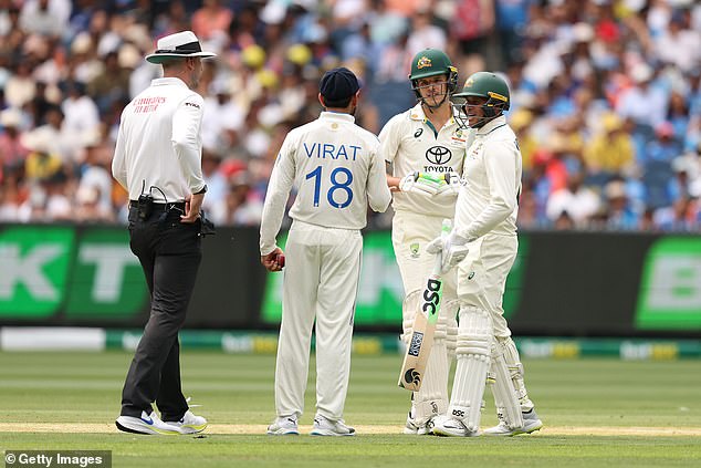 The teenager's batting partner Usman Khawaja (right) had to get between the rivals to calm the situation - before Konstas returned to smashing the Indian attack