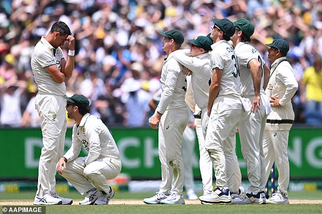 Pictured: Starc (left) and his teammates are left shocked when Jaiswal is allowed to remain at the crease during India's tense run chase