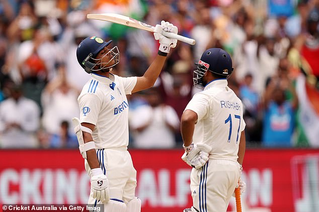 Jaiswal is pictured saluting the crowd after rubbing salt into Australia's wounds by recording a very timely half century on Monday