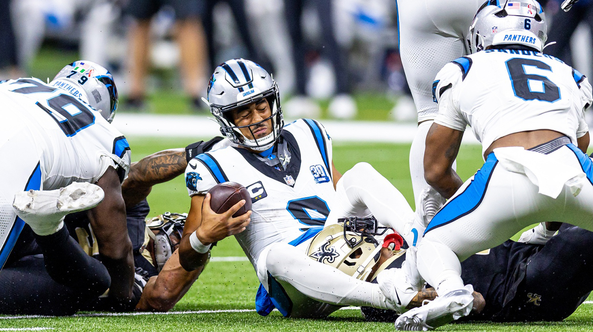 Carolina Panthers quarterback Bryce Young (9) is tackled as he scrambles out the pocket by New Orleans Saints cornerback Alontae Taylor (1) during the second half at Caesars Superdome.