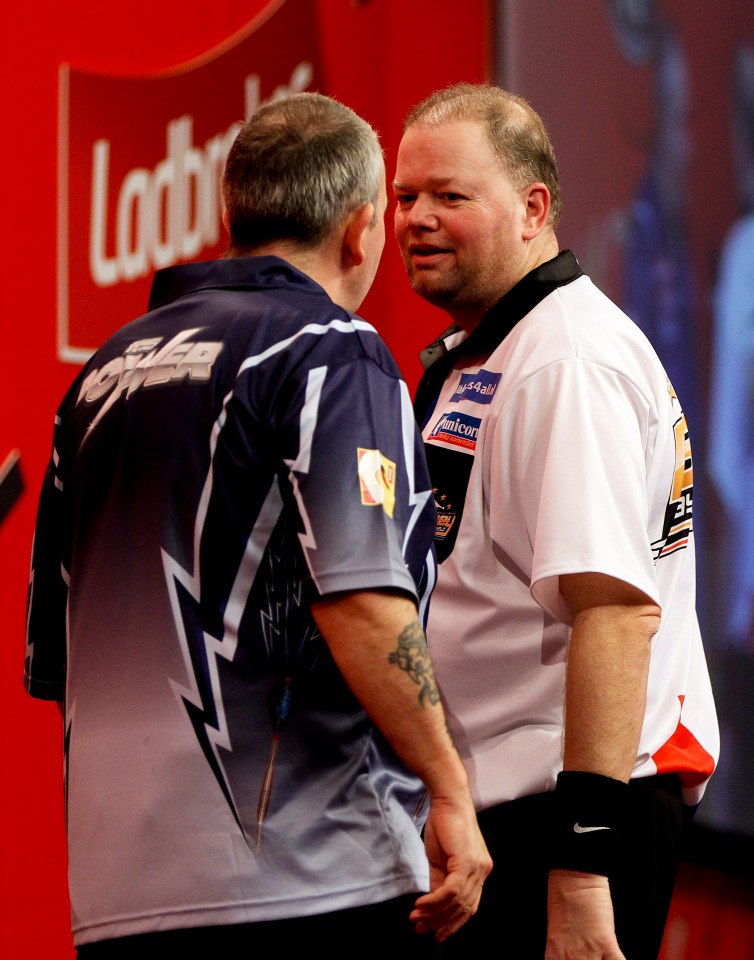 Taylor and Van Barneveld continued to argue after the match was concluded