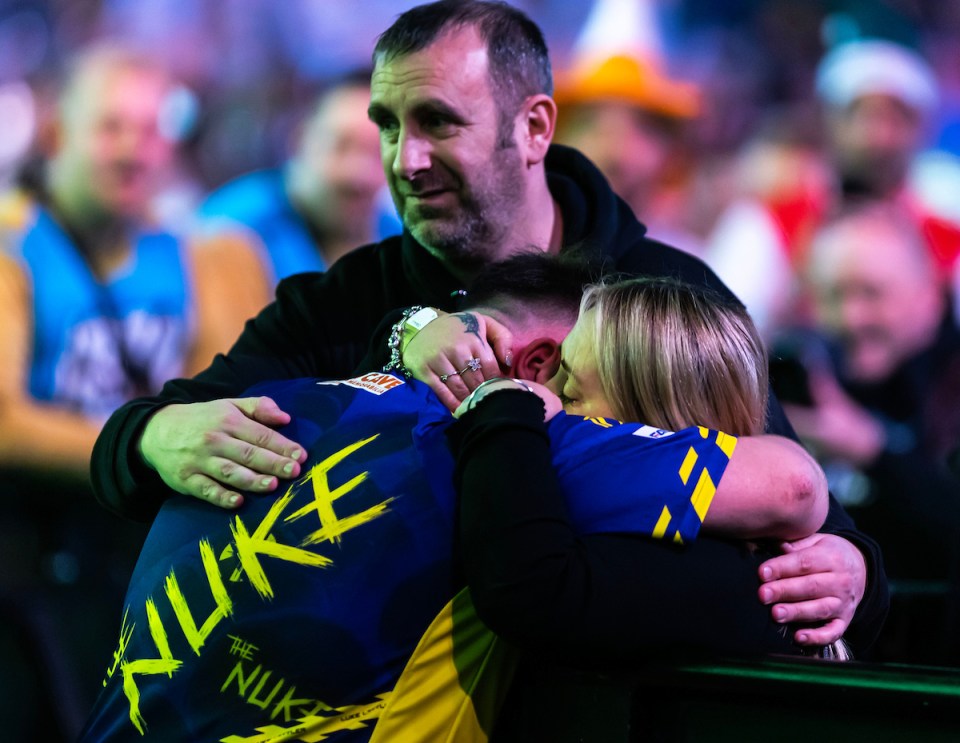 A teary Littler is consoled by his parents after he became emotional during an interview