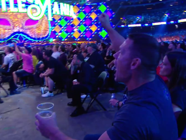 Cena was filmed drinking a beer in the WrestleMania crowd