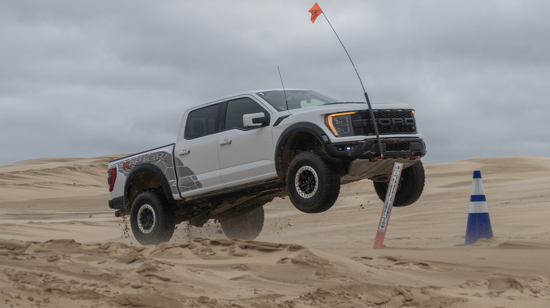 2023 Ford F-150 Raptor R hitting a jump.