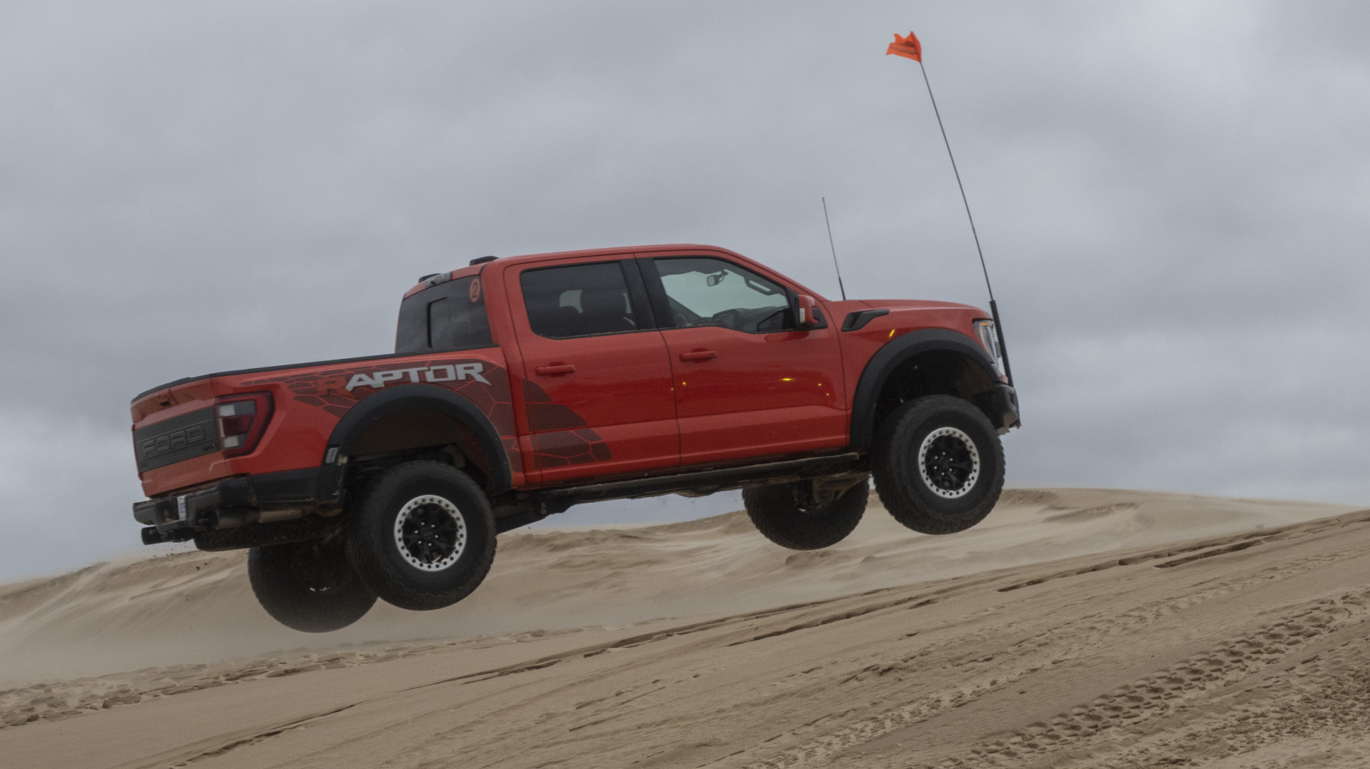 2023 Ford F-150 Raptor R hitting a jump.