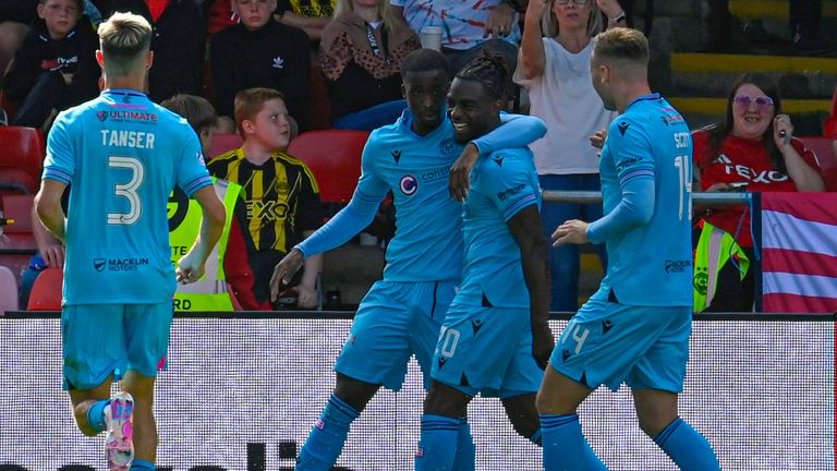 Toyosi Olusanya (second right) celebrates scoring to make it 1-1