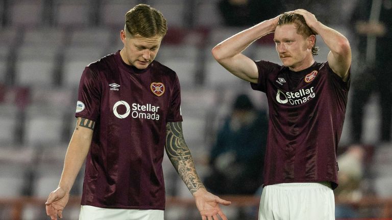 Hearts' Frankie Kent and Kye Rowles (R) look dejected during a William Hill Premiership match between Heart of Midlothian and Celtic at Tynecastle Park on November 23, 2024, in Edinburgh, Scotland. (Photo by Craig Foy / SNS Group)