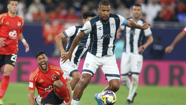 Al Ahly's Yahya Attiat-Allah, bottom, reacts after competing for the ball against CF Pachuca's Salomon Rondon during the Intercontinental Cup soccer match between CF Pachuca and Al Ahly FC at Stadium 974 in Doha, Qatar, Saturday, Dec. 14, 2024. (AP Photo/Hussein Sayed)