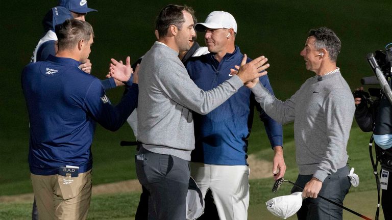 Bryson DeChambeau and Brooks Koepka pictured alongside victorious pairing Scottie Scheffler and Rory McIlroy, as handshakes and high-fives are exchanged on the 16th green during 'The Showdown' at Shadow Creek Golf Course in Las Vegas, Nevada (Photo by Montana Pritchard/LIV Golf)