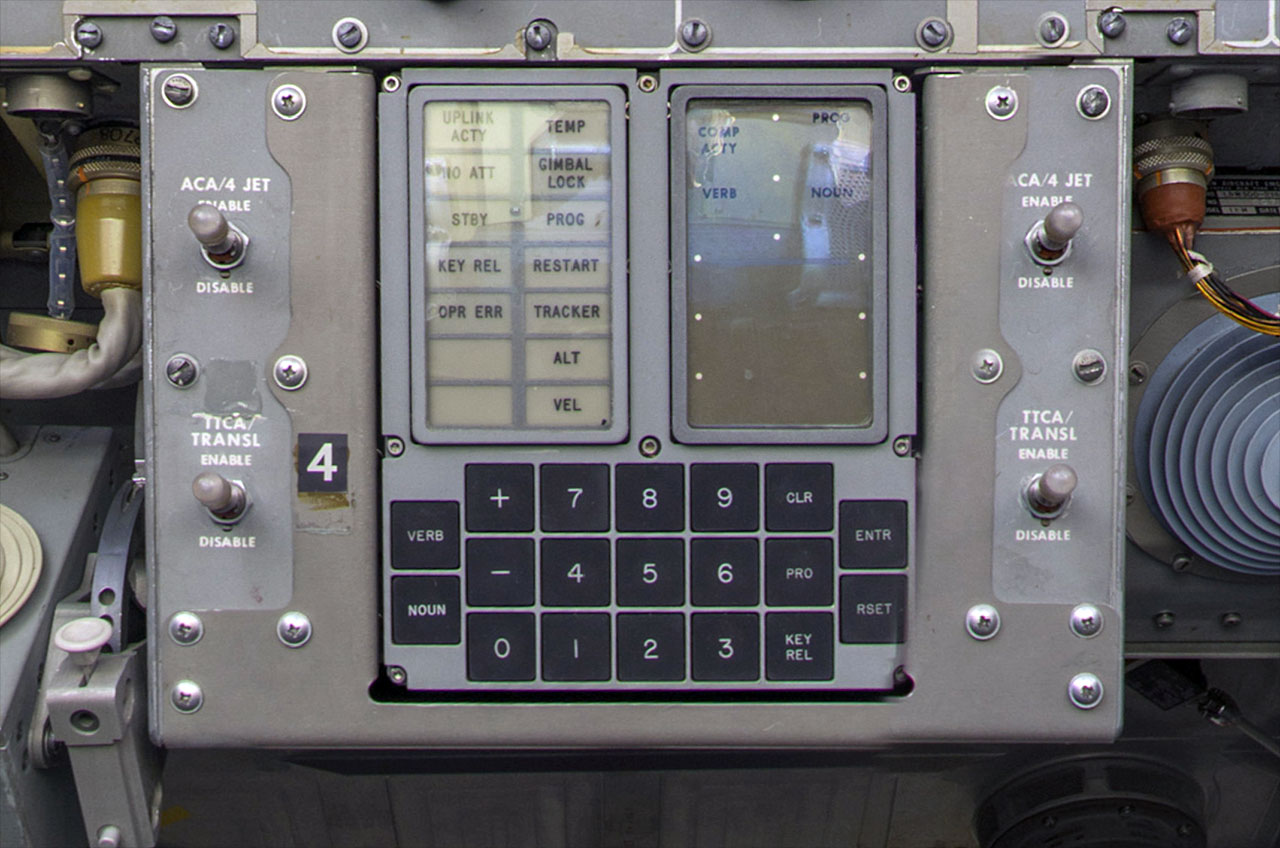 A display and keyboard interface is shown installed aboard an Apollo spacecraft.