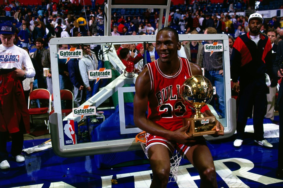 8 Feb 1987: Michael Jordan #23 of the Chicago Bulls celebrates after winning the 1987 NBA All Star Slam Dunk Competition at the Kingdome in Seattle, WA.  HIGH RESOLUTION FILE 42MB. NOTE TO USER: User expressly acknowledges and agrees that, by downloadingand/or using this Photograph, User is consenting to the terms and conditions of the Getty Images License Agreement.  Mandatory copyright notice and Credit: Copyright 2001 NBAE  Mandatory Credit: Andrew D. Bernstein/NBAE/Getty Images