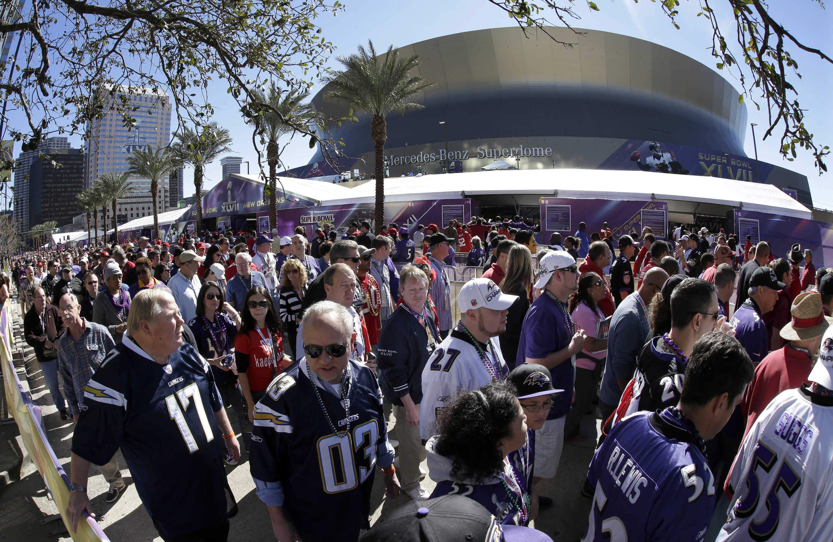 In this photo made with a fisheye lens, fans line up to enter the Superdome before the NFL Super Bowl XLVII football game between the San Francisco 49ers and the Baltimore Ravens on Sunday, Feb. 3, 2013, in New Orleans. (AP Photo/Gene Puskar)