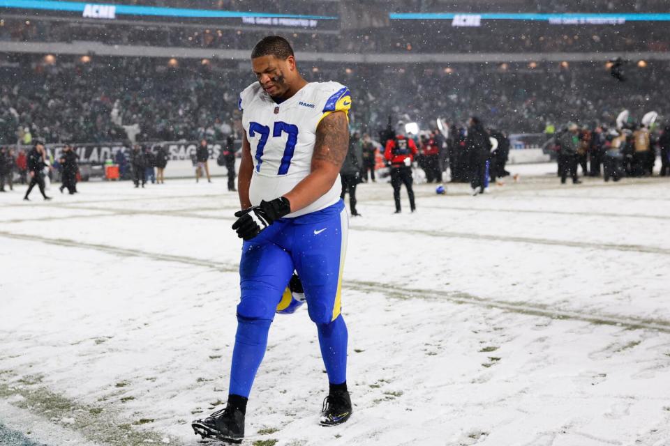 Rams offensive tackle Alaric Jackson walks off the field after a divisional playoff loss to the Philadelphia Eagles.