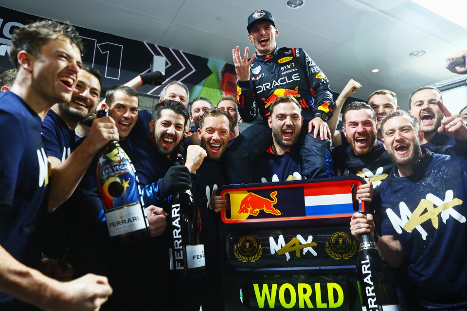 Max Verstappen celebrating his 2024 Formula 1 World Championship win with his team.