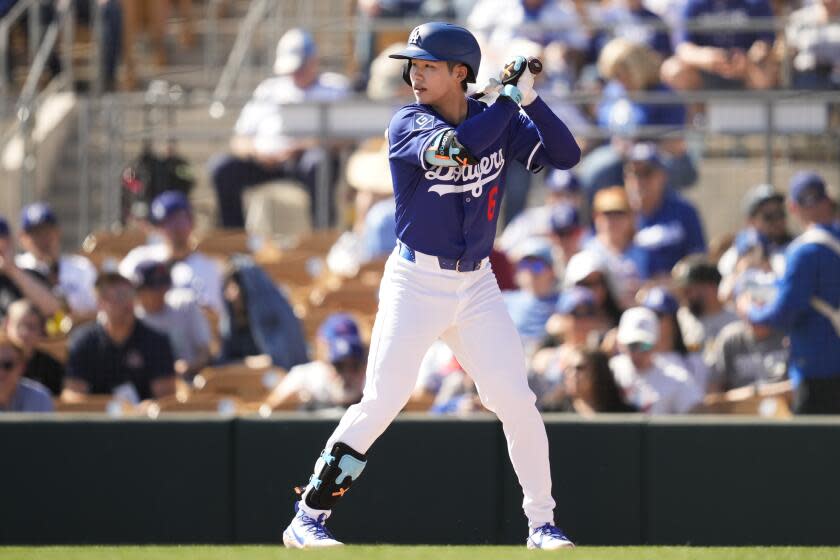 Los Angeles Dodgers' Hyeseong Kim prepares to bat during the second inning of a spring training baseball game against the Chicago Cubs, Thursday, Feb. 20, 2025, in Phoenix. (AP Photo/Ashley Landis)