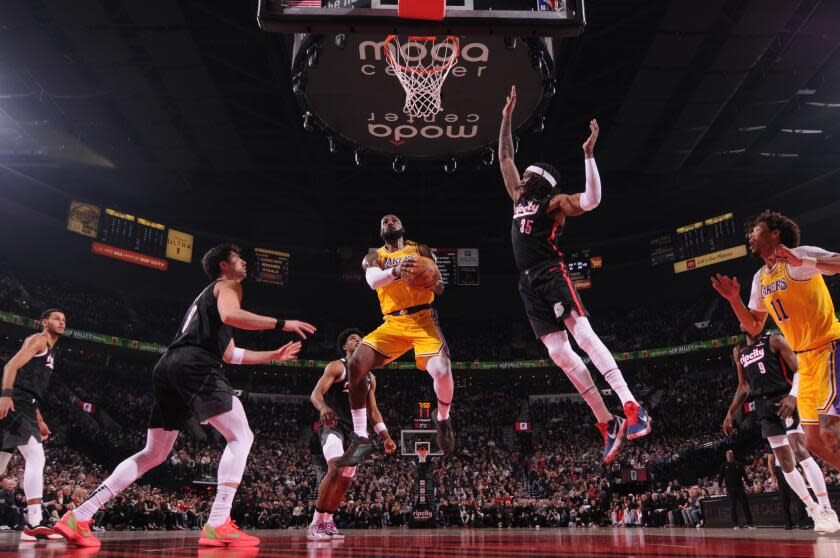 PORTLAND, OR - FEBRUARY 20: LeBron James #23 of the Los Angeles Lakers drives.