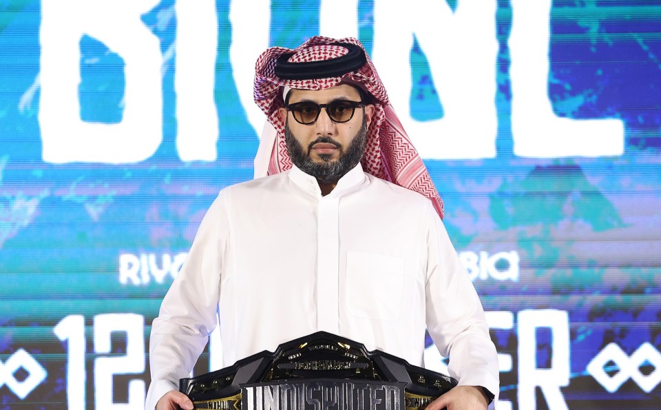 Turki Alalshikh holding the Undisputed belt at the Riyadh Season weigh-in.