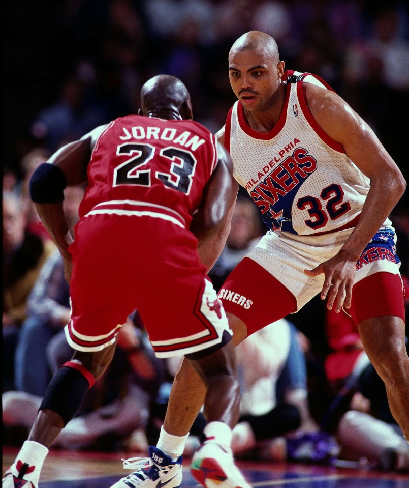 Charles Barkley defending Michael Jordan during an NBA game.