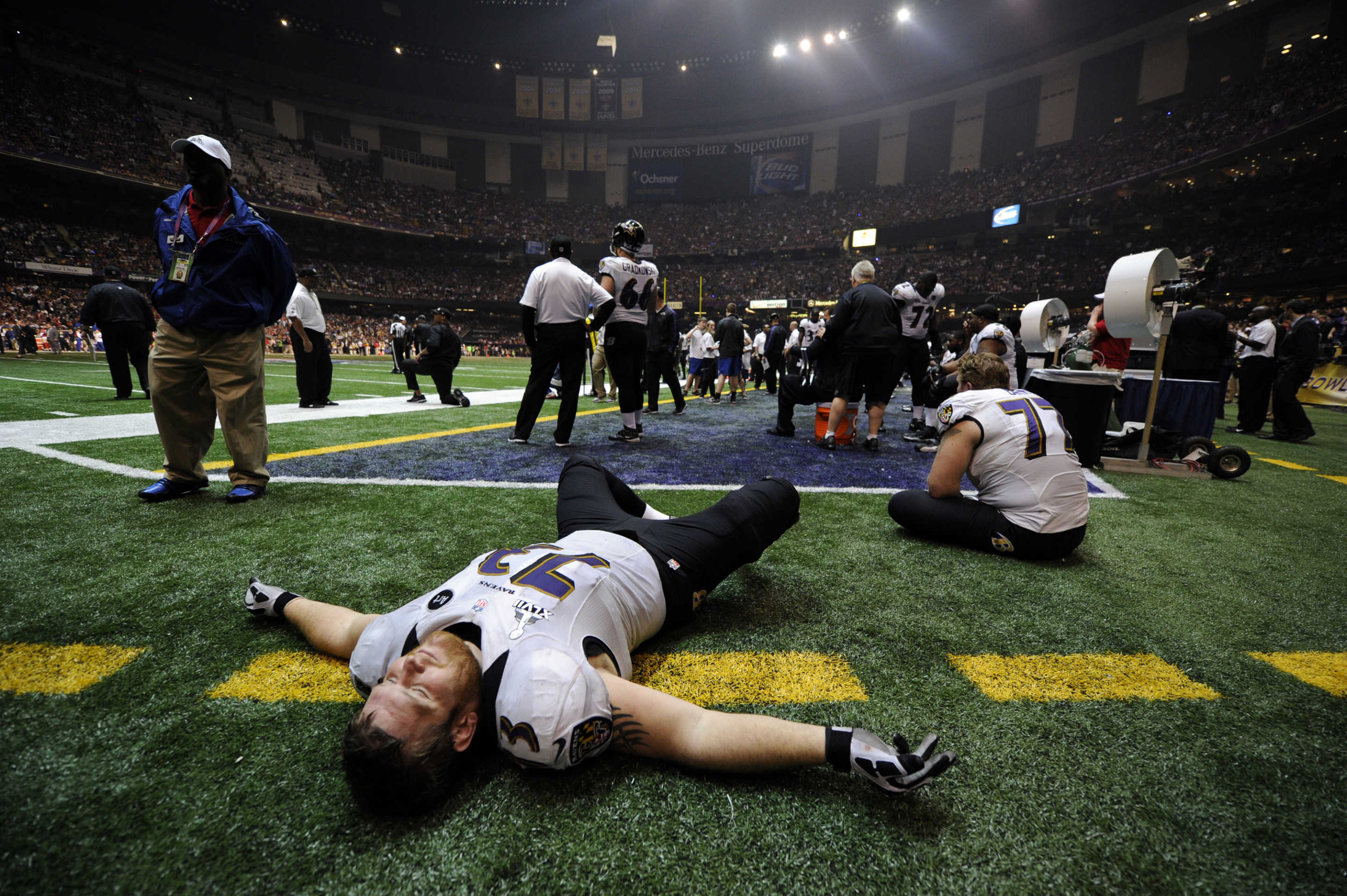 Baltimore Ravens' Marshal Yanda (73) relaxes on the field turf while waiting out a 35-minute power outage at the Superdome during the third quarter of Super Bowl XLVII, Sunday, Feb. 3, 2013, in New Orleans. (Jose Carlos Fajardo/Bay Area News Group) (Photo by JOSE CARLOS FAJARDO/MediaNews Group/Bay Area News via Getty Images)