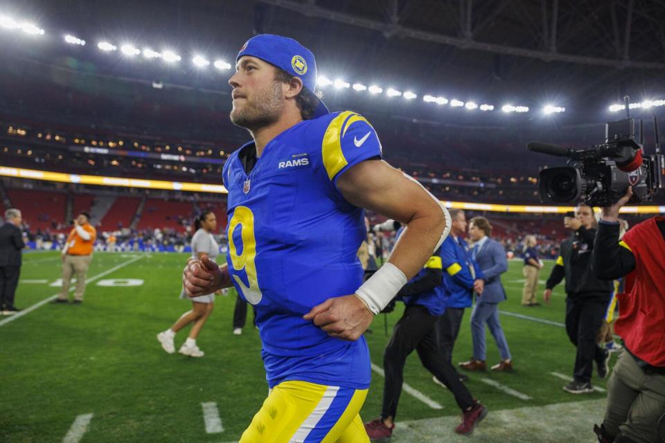 Rams quarterback Matthew Stafford jogs off the field following a wild-card playoff win over the Minnesota Vikings.