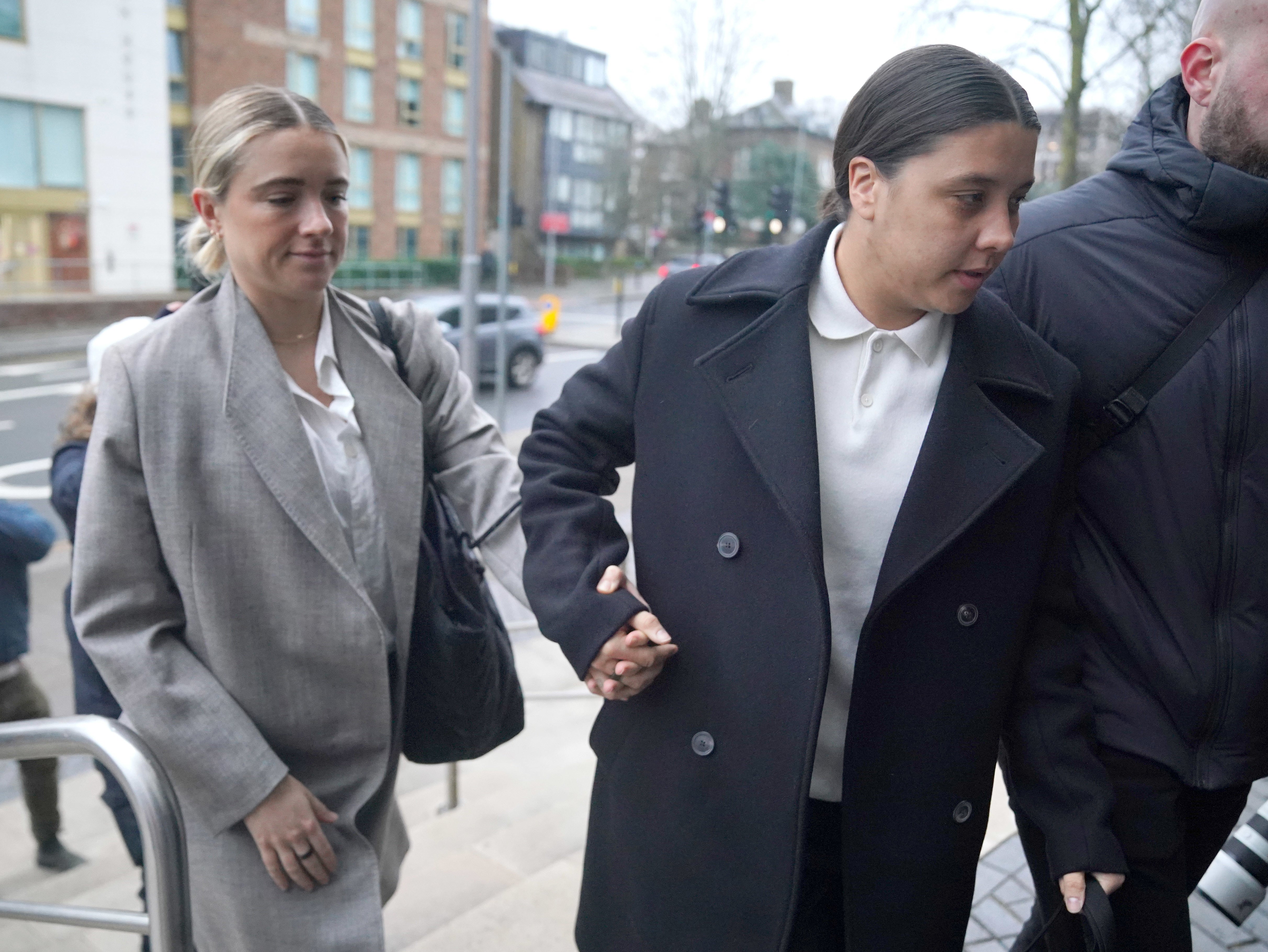 Chelsea and Australia striker Sam Kerr arrives wither partner and fellow footballer Kristie Mewis at Kingston Crown Court