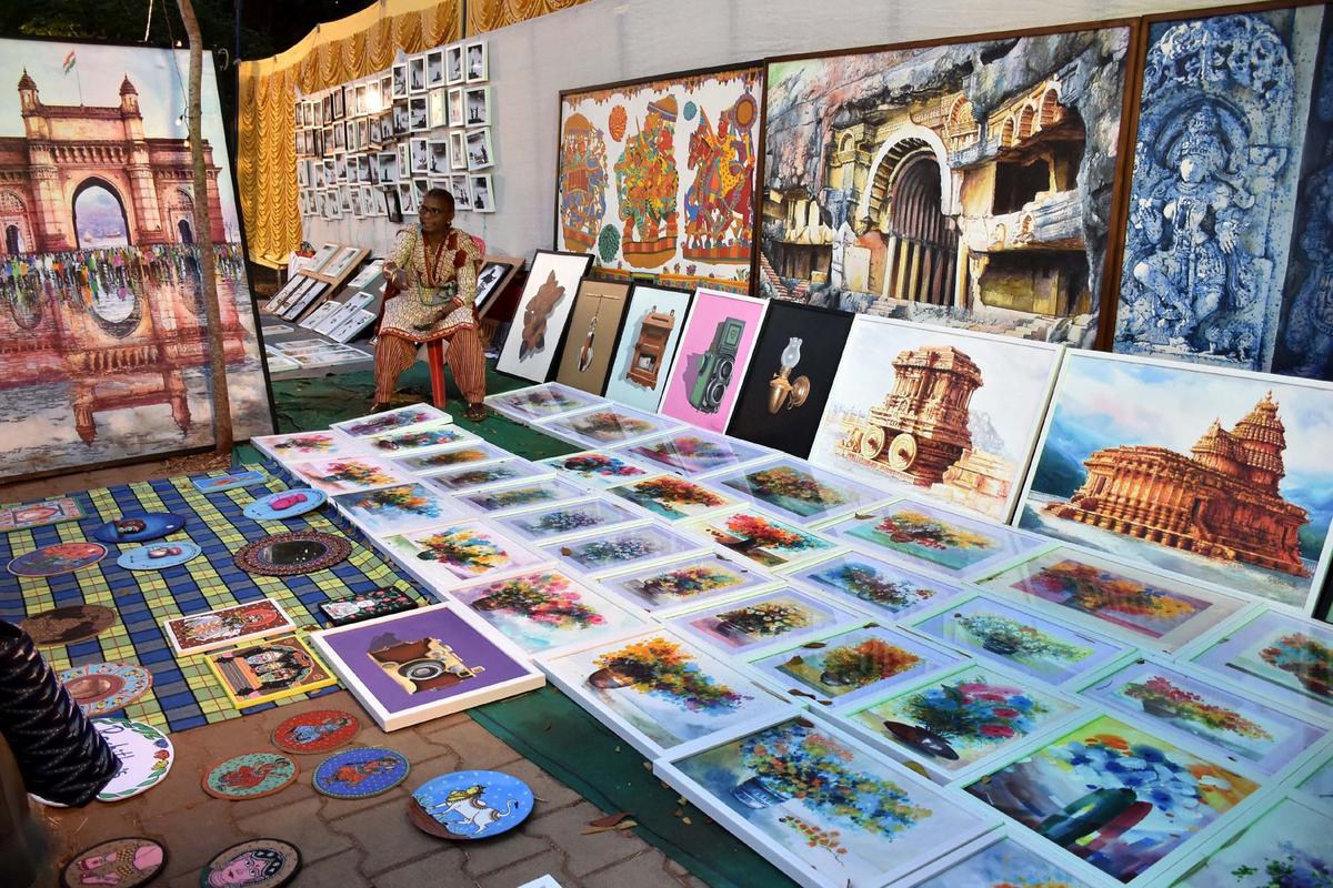 Paintings on the landmarks of Karnataka on display at an event in Mysore.