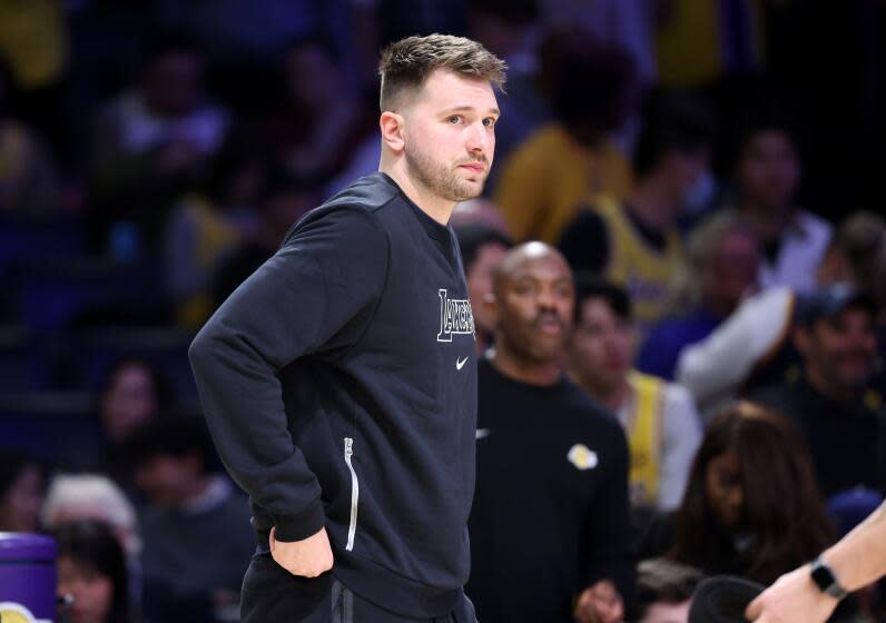 Los Angeles, California February 6, 2025-Lakers Luka Doncic watches the game from the bench during a game with the Warriors at Crypto.com Arena Thursday. (Wally Skalij/Los Angeles Times)