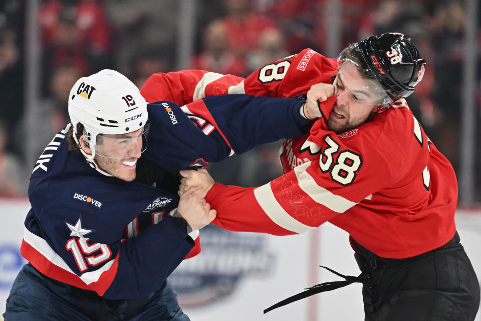 USA's Matthew Tkachuk fights with Canada's Brandon Hagel. (Minas Panagiotakis/Getty Images)