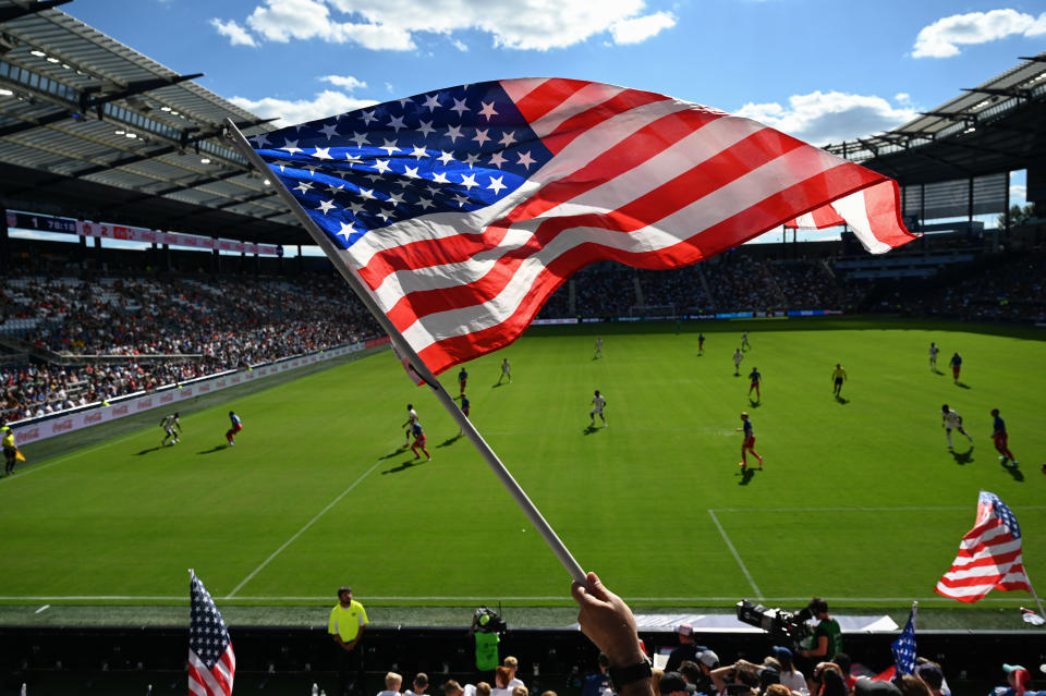 KANSAS CITY, KANSAS - SEPTEMBER 07: A United States fan waves an American flag during an international friendly between the United States and Canada at Children's Mercy Park on September 07, 2024 in Kansas City, Kansas. (Photo by Eric Thomas/USSF/Getty Images for USSF)