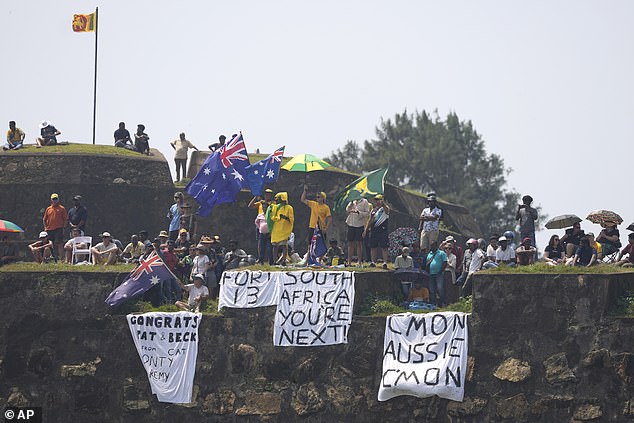 Aussie fans congregated on the hill next to the oval with some fans congratulating Cummins and his partner while others issued a warning for South Africa