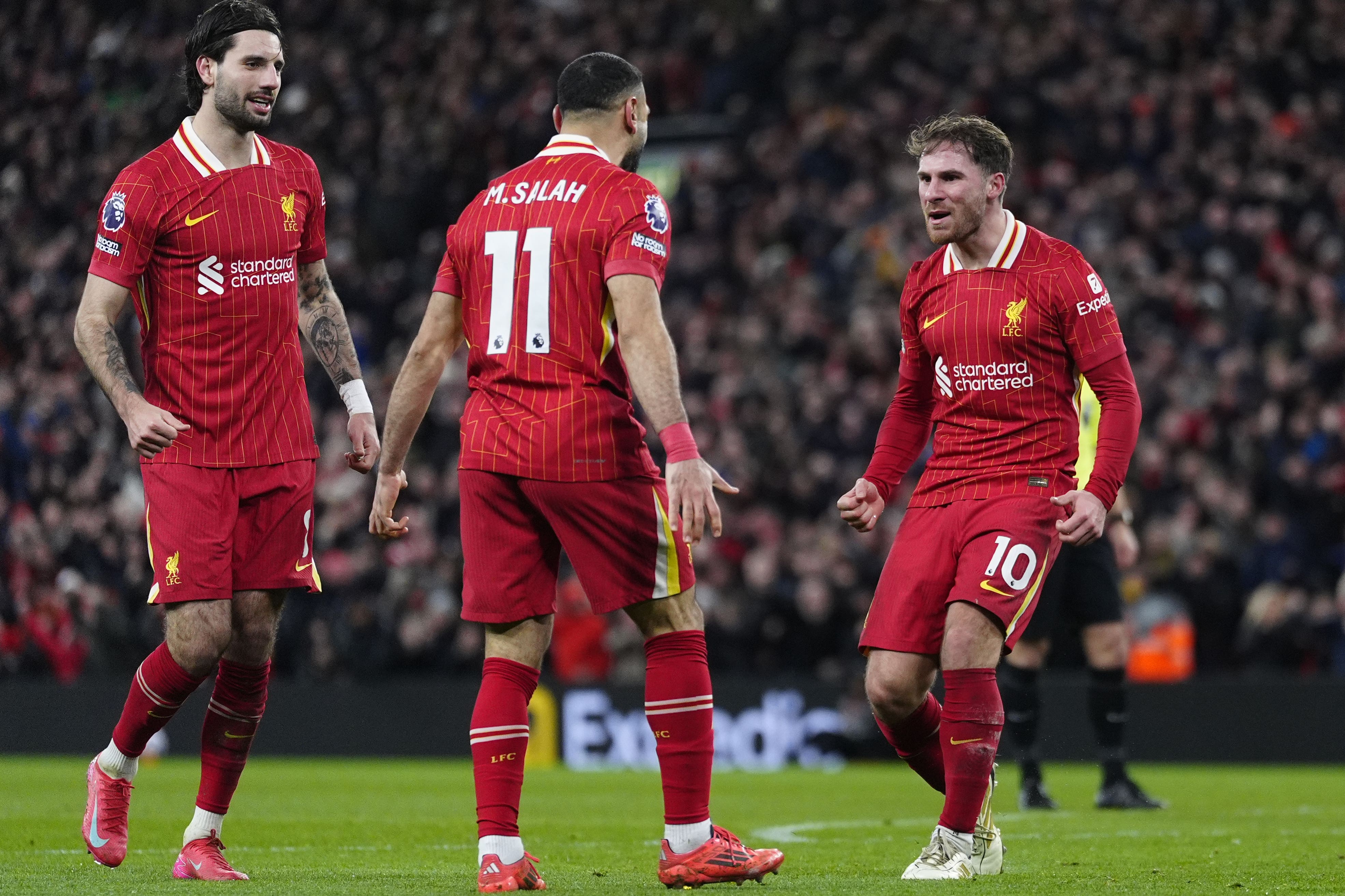 Alexis Mac Allister, right, celebrates with team-mates after scoring Liverpool’s second goal against Newcastle