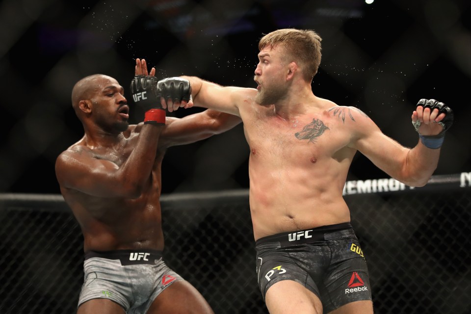 Jon Jones avoids a punch from Alexander Gustafsson during a UFC fight.