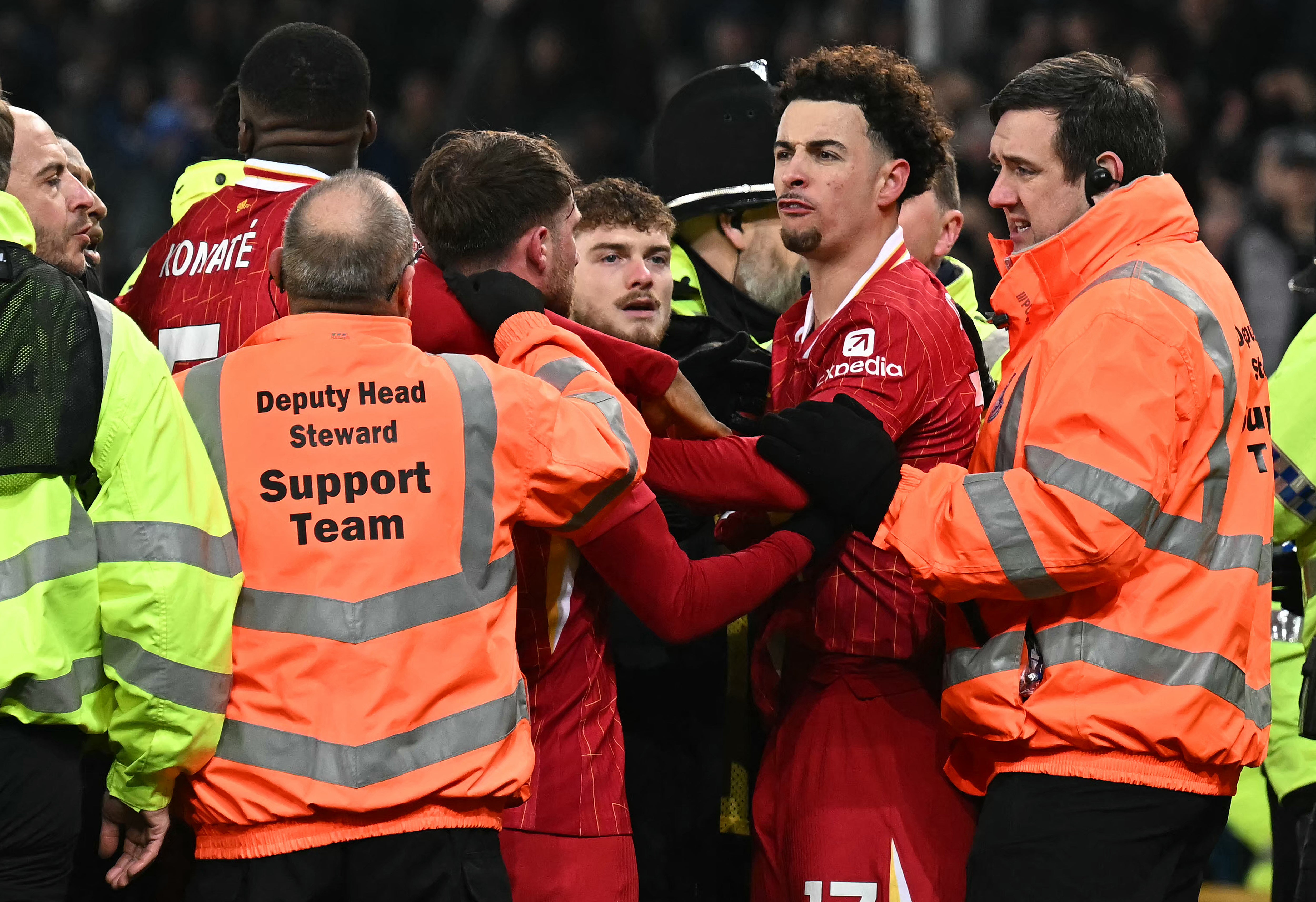 Stewards and police intervene as the Merseyside derby boils over