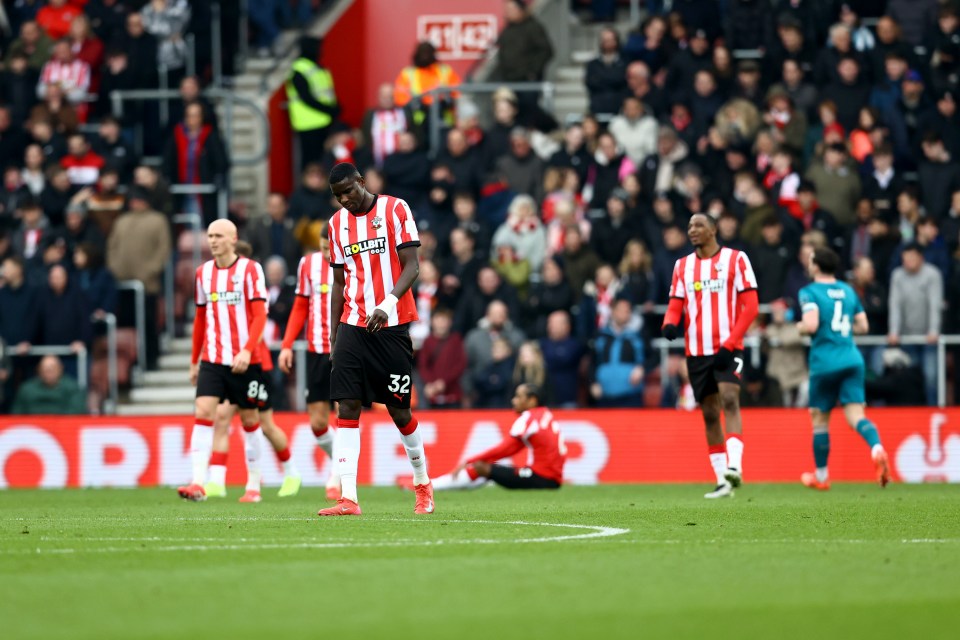 Southampton FC player walking on the field during a match.