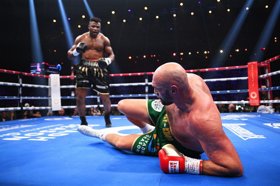 Tyson Fury down in the boxing ring after being knocked down by Francis Ngannou.