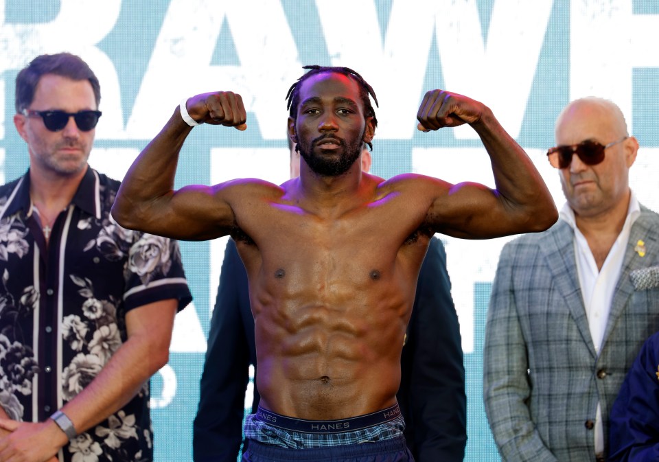 LOS ANGELES, CALIFORNIA - AUGUST 2: Terence Crawford (L), a welterweight undisputed champion, poses on the scale after his official weigh-in at LA Live on August 2, 2024 in Los Angeles, California. Crawford and Madrimov will fight for the super-welterweight title on Saturday August 3, 2024 at BMO Stadium in Los Angeles, California. (Photo by Kevork Djansezian/Getty Images)