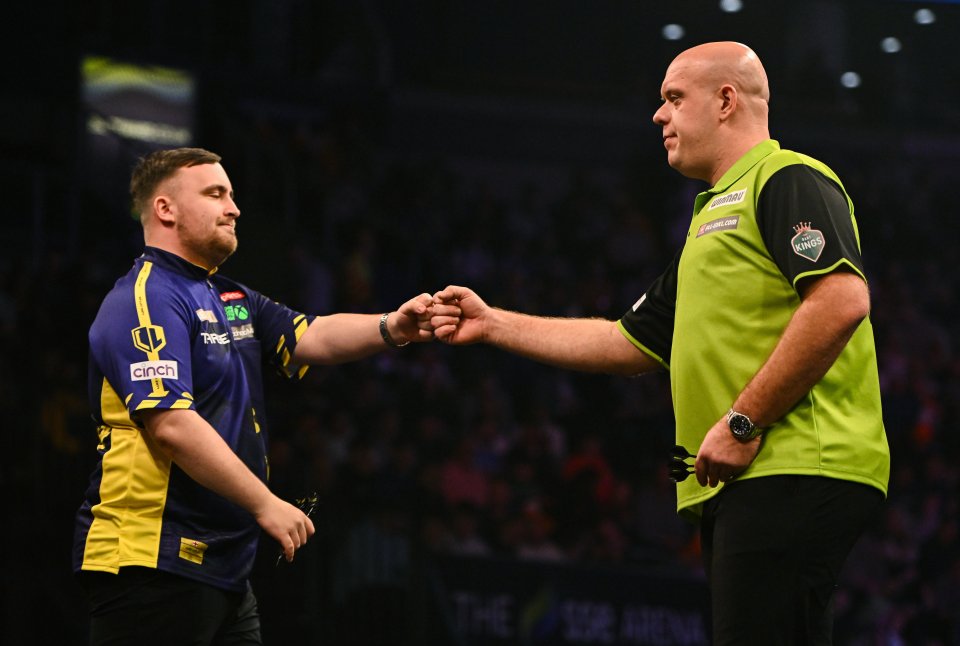 Belfast , United Kingdom - 6 February 2025; Luke Littler, left, and Michael van Gerwen shake hands before their quarter-final match on night one of the BetMGM Premier League Darts at SSE Arena in Belfast. (Photo By Ben McShane/Sportsfile via Getty Images)