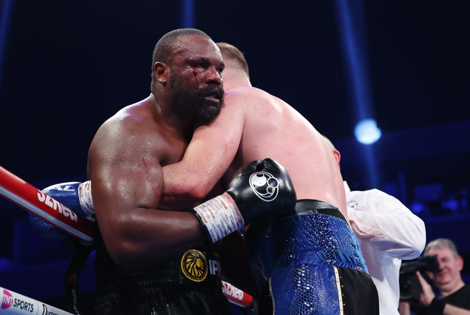 MANCHESTER, ENGLAND - FEBRUARY 08: Derek Chisora, with a cut and blood on his face, looks on whilst in a clinch with Otto Wallin during the Heavyweight fight between Derek Chisora and Otto Wallin as part of Derek Chisora v Otto Wallin, The Last Dance card at Co-op Live on February 08, 2025 in Manchester, England. (Photo by Alex Livesey/Getty Images)