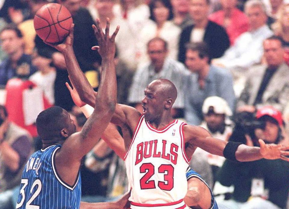 Michael Jordan of the Chicago Bulls shooting a basketball.