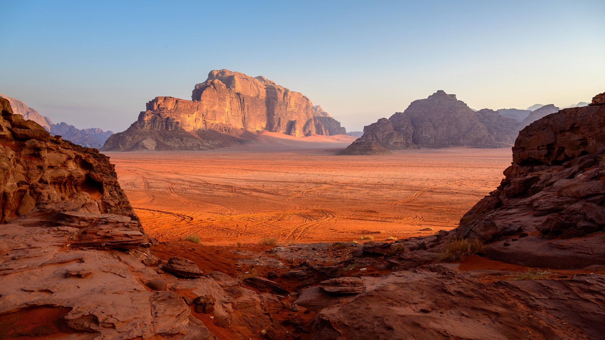 Rocky desert landscape with red sand.