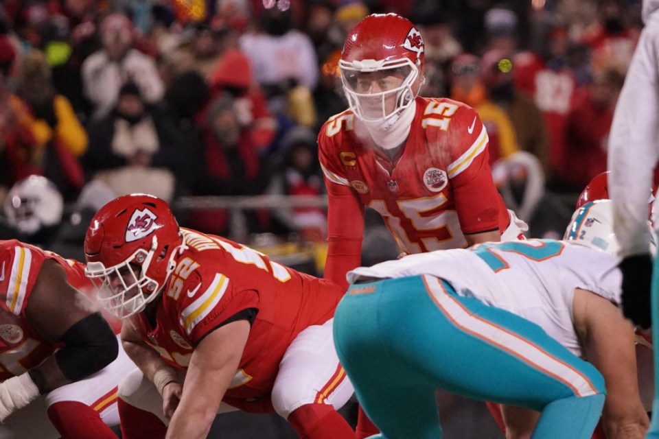 Jan 13, 2024; Kansas City, Missouri, USA; Kansas City Chiefs quarterback Patrick Mahomes (15) before taking the snap against the Miami Dolphins during the second half of the 2024 AFC wild card game at GEHA Field at Arrowhead Stadium. Mandatory Credit: Denny Medley-USA TODAY Sports